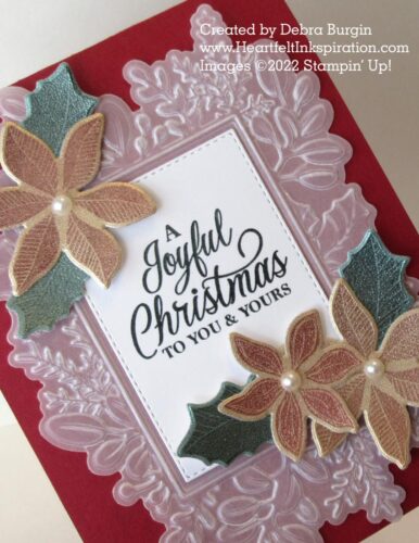 Merriest Moments | Merriest Frames | This Christmas card owes its frostiness to an embossed vellum frame and poinsettia and leaf images stamp on Fine Shimmer paper.  Please click to read more! | Stampin' Up! | HeartfeltInkspiration.com | Debra Burgin  